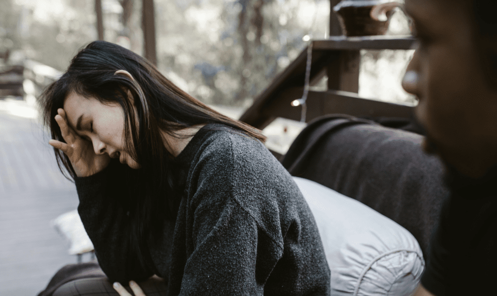 woman and man in middle of breakup trying to heal looking sad