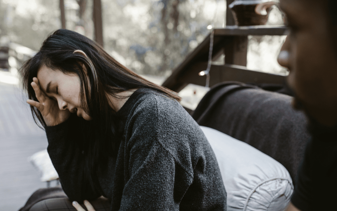 woman and man in middle of breakup trying to heal looking sad