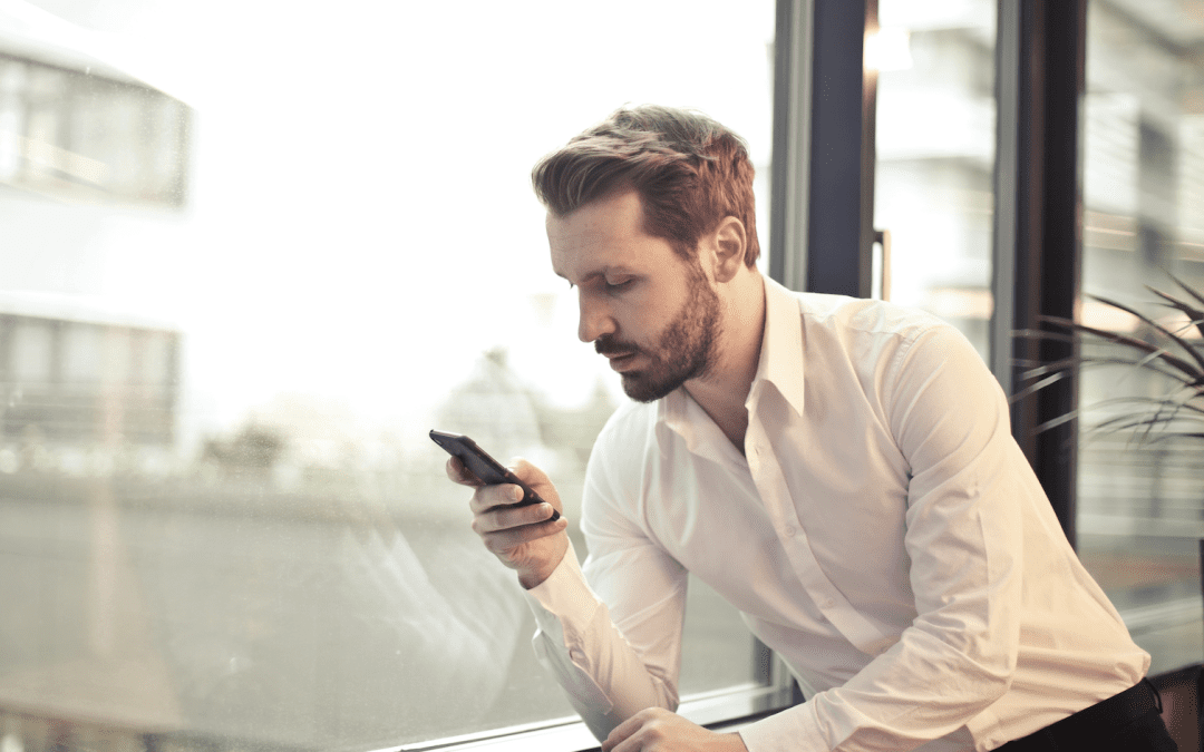 Man looking at phone. Tinder, dating apps