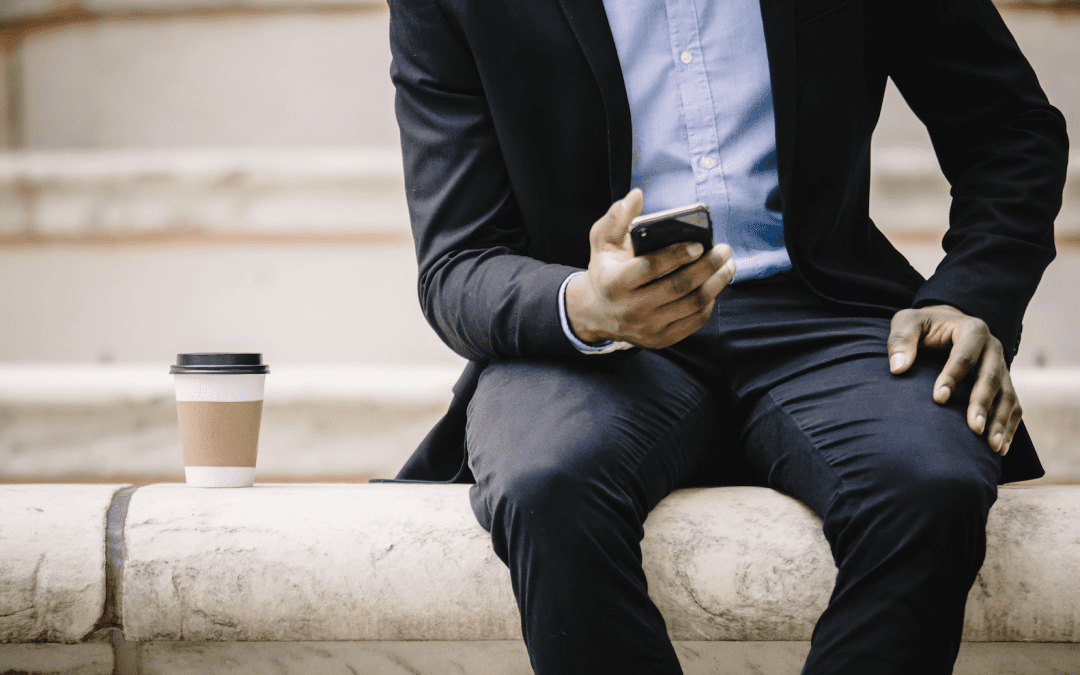 man in suit holding phone, communication in dating